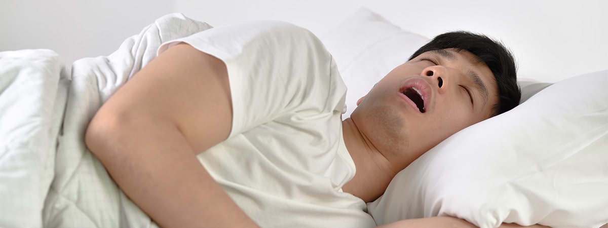 man sleeping with mouth open
